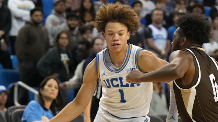 Nov 15, 2024; Los Angeles, California, USA; UCLA Bruins guard Trent Perry (1) dribbles the ball against Lehigh Mountain Hawks guard Cam Gillus (0)  in the second half at Pauley Pavilion presented by Wescom. Mandatory Credit: Kirby Lee-Imagn Images