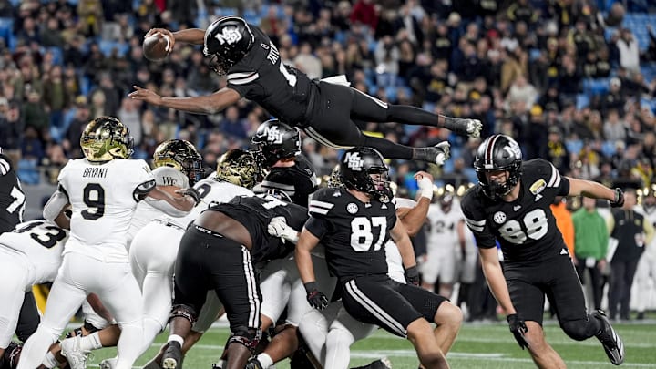 Mississippi State Bulldogs quarterback Kamario Taylor (1) leaps for a touchdown attempt against the Wake Forest Demon Deacons during the second half at Bank of America Stadium.