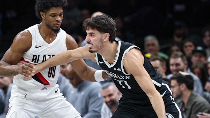Mar 16, 2026; Brooklyn, New York, USA; Brooklyn Nets guard Ben Saraf (77) is guarded by Portland Trail Blazers guard Scoot Henderson (00) during the first half at Barclays Center. Mandatory Credit: Vincent Carchietta-Imagn Images
