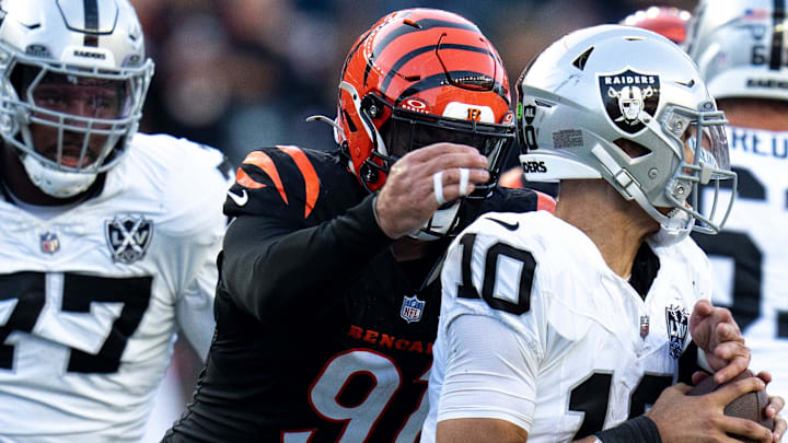 Cincinnati Bengals defensive end Trey Hendrickson (91) strips Las Vegas Raiders quarterback Desmond Ridder (10) of the ball in the fourth quarter of the NFL game at Paycor Stadium in Cincinnati on Sunday, Nov. 3, 2024.