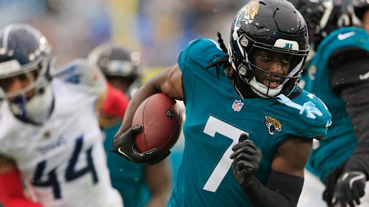 Jacksonville Jaguars wide receiver Brian Thomas Jr. (7) rushes for yards during the second quarter of an NFL football matchup Sunday, Dec. 29, 2024 at EverBank Stadium in Jacksonville, Fla. The Jaguars held off the Titans 20-13. [Corey Perrine/Florida Times-Union]