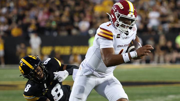 Sep 12, 2026; Iowa City, Iowa, USA; Iowa State Cyclones quarterback Jaylen Raynor (1) carries the ball as Iowa Hawkeyes defensive back Deshaun Lee (8) defends during the second quarter at Kinnick Stadium. Mandatory Credit: Reese Strickland-Imagn Images Sep 12, 2026; Iowa City, Iowa, USA; Iowa State Cyclones quarterback Jaylen Raynor (1) carries the ball as Iowa Hawkeyes defensive back Deshaun Lee (8) defends during the second quarter at Kinnick Stadium. Mandatory Credit: Reese Strickland-Imagn Images