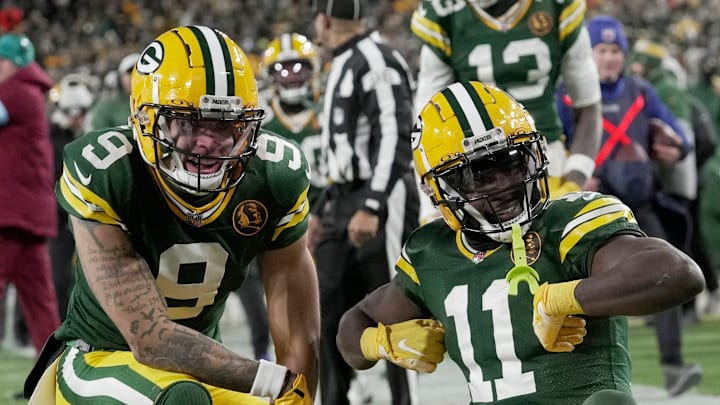 Green Bay Packers wide receiver Jayden Reed (11) celebrates his touchdown reception with wide receiver Christian Watson vs. Miami.
