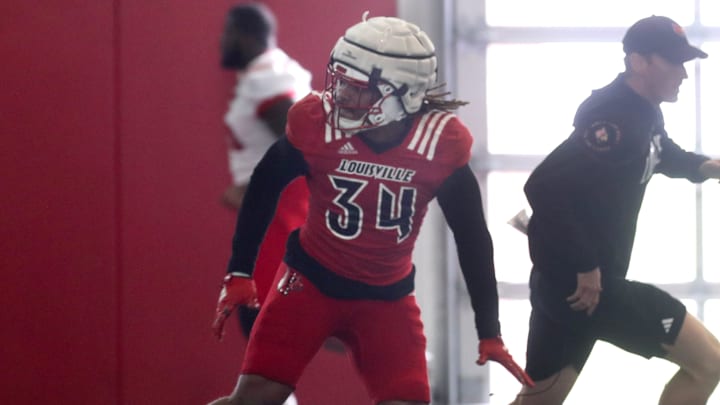 Louisville linebacker TJ Quinn (34) runs a rep during Spring Practice on Thursday