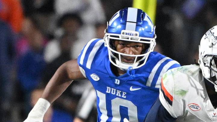 Nov 15, 2025; Durham, North Carolina, USA; Virginia Cavaliers wide receiver Trell Harris (11) runs the ball against Duke Blue Devils defensive end Tyshon Reed (10) during the third quarter at Wallace Wade Stadium. Mandatory Credit: Zachary Taft-Imagn Images Nov 15, 2025; Durham, North Carolina, USA; Virginia Cavaliers wide receiver Trell Harris (11) runs the ball against Duke Blue Devils defensive end Tyshon Reed (10) during the third quarter at Wallace Wade Stadium. Mandatory Credit: Zachary Taft-Imagn Images