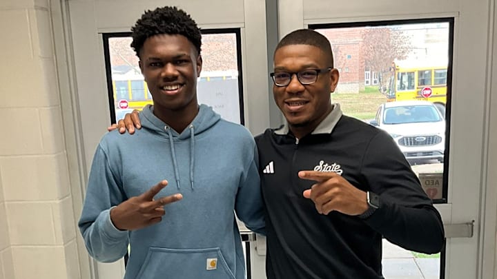 Ridgeland (Miss.) safety Trae Collins with Mississippi State assistant coach Kevie Thompson.