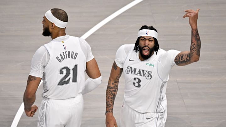 Feb 8, 2025; Dallas, Texas, USA; Dallas Mavericks center Daniel Gafford (21) and forward Anthony Davis (3) celebrate after Davis dunks the ball against the Houston Rockets during the first quarter at American Airlines Center. Mandatory Credit: Jerome Miron-Imagn Images