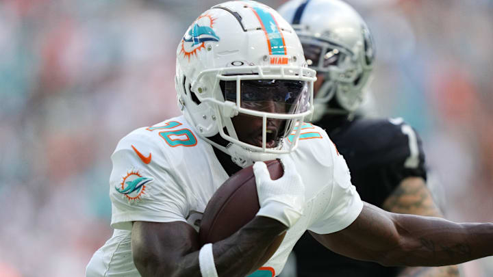 Miami Dolphins wide receiver Tyreek Hill (10) scores a touchdown during the first half of an NFL game against the Las Vegas Raiders at Hard Rock Stadium in Miami Gardens, Nov. 19, 2023.