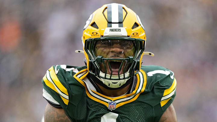 Nov 23, 2025; Green Bay, Wisconsin, USA;  Green Bay Packers defensive end Micah Parsons (1) celebrates following a sack during the third quarter against the Minnesota Vikings at Lambeau Field. 
