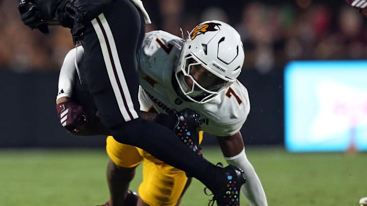 Sep 6, 2025; Starkville, Mississippi, USA; Arizona State Sun Devils defensive back Montana Warren (7) tackles Mississippi State Bulldogs wide receiver Anthony Evans III (3) during the third quarter at Davis Wade Stadium at Scott Field. Mandatory Credit: Petre Thomas-Imagn Images