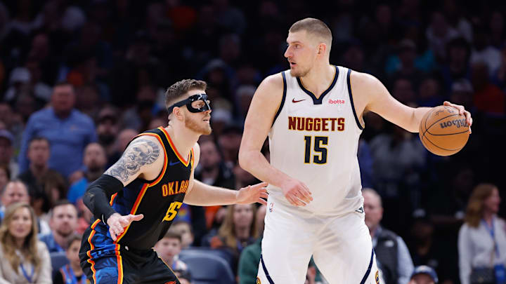 Mar 9, 2025; Oklahoma City, Oklahoma, USA; Oklahoma City Thunder center Isaiah Hartenstein (55) defends Denver Nuggets center Nikola Jokic (15) during the second half at Paycom Center. Mandatory Credit: Alonzo Adams-Imagn Images