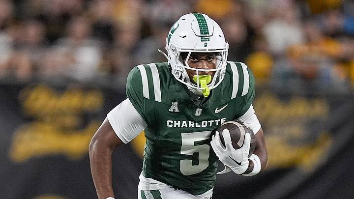 Aug 29, 2025; Charlotte, North Carolina, USA; Charlotte 49ers wide receiver Javen Nicholas (5) runs for yards after catch defended by Appalachian State Mountaineers defensive back Ethan Johnson (2) during the second half at Bank of America Stadium. Mandatory Credit: Jim Dedmon-Imagn Images Aug 29, 2025; Charlotte, North Carolina, USA; Charlotte 49ers wide receiver Javen Nicholas (5) runs for yards after catch defended by Appalachian State Mountaineers defensive back Ethan Johnson (2) during the second half at Bank of America Stadium. Mandatory Credit: Jim Dedmon-Imagn Images
