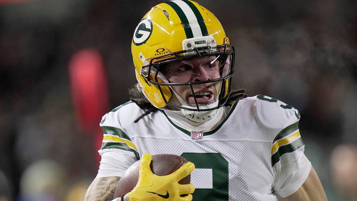 Green Bay Packers wide receiver Christian Watson (9) makes a catch for a first down