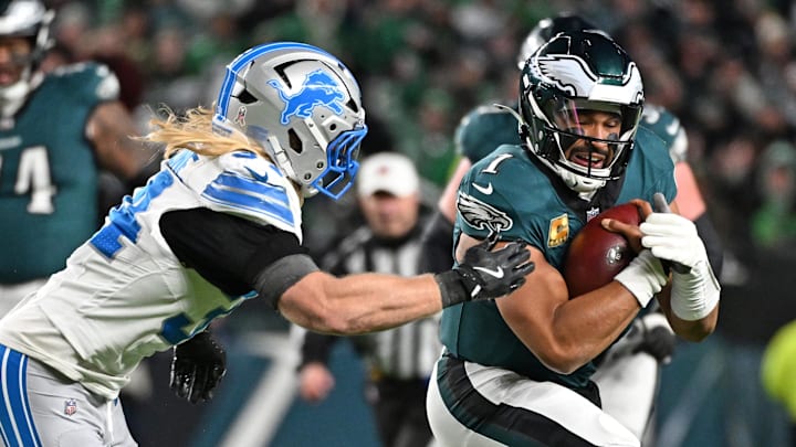 Philadelphia Eagles quarterback Jalen Hurts (1) is tackled by Detroit Lions linebacker Alex Anzalone (34) Philadelphia Eagles quarterback Jalen Hurts (1) is tackled by Detroit Lions linebacker Alex Anzalone (34)