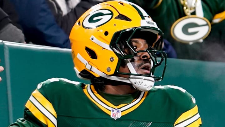 Dec 27, 2025; Green Bay, Wisconsin, USA; Green Bay Packers quarterback Malik Willis (2) high-fives fans after a touchdown during the third quarter against the Baltimore Ravens at Lambeau Field. Mandatory Credit: Kayla Wolf-Imagn Images