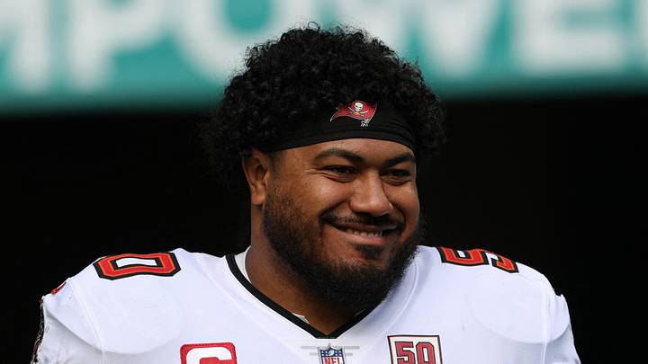 Tampa Bay Buccaneers defensive tackle Vita Vea (50) walks out for player introductions prior to a game against the Miami Dolphins Tampa Bay Buccaneers defensive tackle Vita Vea (50) walks out for player introductions prior to a game against the Miami Dolphins