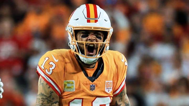 Dec 11, 2025; Tampa, Florida, USA; Tampa Bay Buccaneers wide receiver Mike Evans (13) reacts after catching a pass against Atlanta Falcons safety Jessie Bates III (3) (obscured) during the third quarter at Raymond James Stadium. Mandatory Credit: Kim Klement Neitzel-Imagn Images
