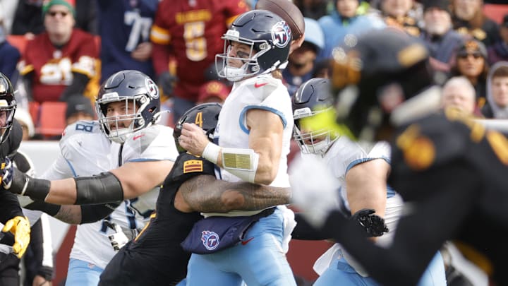 Dec 1, 2024; Landover, Maryland, USA; Tennessee Titans quarterback Will Levis (8) throws the ball as Washington Commanders linebacker Frankie Luvu (4) tackles during the first half at Northwest Stadium. Mandatory Credit: Amber Searls-Imagn Images Dec 1, 2024; Landover, Maryland, USA; Tennessee Titans quarterback Will Levis (8) throws the ball as Washington Commanders linebacker Frankie Luvu (4) tackles during the first half at Northwest Stadium. Mandatory Credit: Amber Searls-Imagn Images