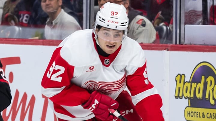 Mar 10, 2025; Ottawa, Ontario, CAN; Ottawa Senators defenseman Thomas Chabot (72) chases Detroit Red Wings center Marco Kasper (92) who controls the puck in the second period at the Canadian Tire Centre. Mandatory Credit: Marc DesRosiers-Imagn Images