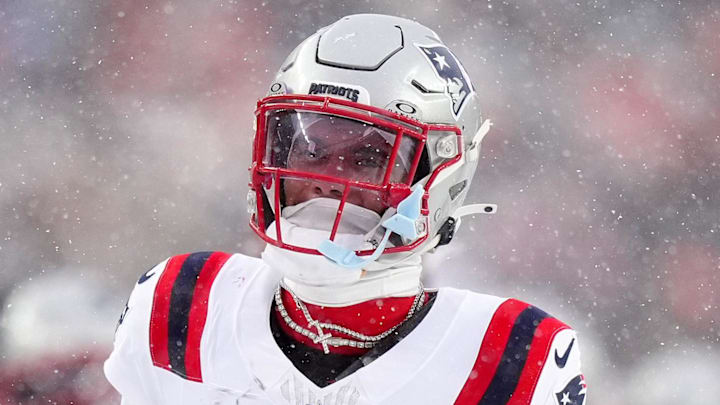 Jan 25, 2026; Denver, CO, USA; New England Patriots cornerback Christian Gonzalez (0) reacts after an interception against the Denver Broncos  during the second half in the 2026 AFC Championship Game at Empower Field at Mile High. Mandatory Credit: Ron Chenoy-Imagn Images