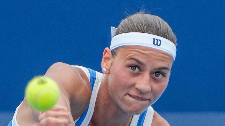 Marta Kostyuk serves a ball Marta Kostyuk serves a ball