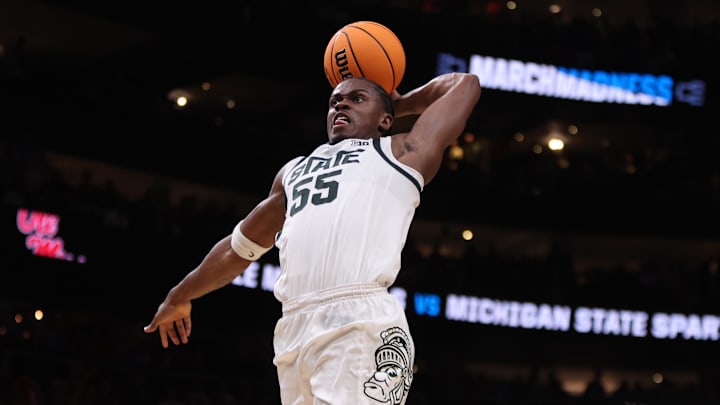 Mar 28, 2025; Atlanta, GA, USA; Michigan State Spartans forward Coen Carr (55) dunks against Mississippi Rebels forward Malik Dia (0) in the second half of a South Regional semifinal of the 2025 NCAA tournament at State Farm Arena. Mandatory Credit: Brett Davis-Imagn Images Mar 28, 2025; Atlanta, GA, USA; Michigan State Spartans forward Coen Carr (55) dunks against Mississippi Rebels forward Malik Dia (0) in the second half of a South Regional semifinal of the 2025 NCAA tournament at State Farm Arena. Mandatory Credit: Brett Davis-Imagn Images