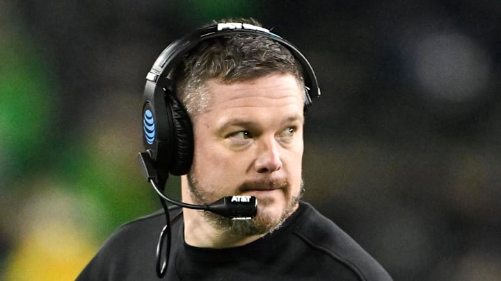Dec 20, 2025; Eugene, OR, USA;  Oregon Ducks head coach Dan Lanning looks on during the fourth quarter against the James Madison Dukes at Autzen Stadium. Mandatory Credit: Craig Strobeck-Imagn Images
