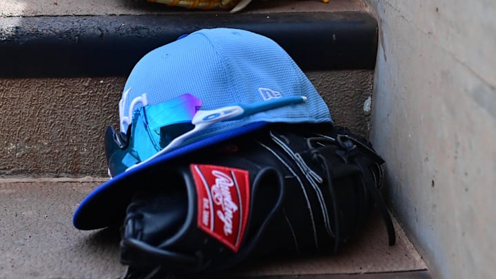 Mar 12, 2024; Salt River Pima-Maricopa, Arizona, USA;  General view of Kansas City Royals hats and gloves in the first inning against the Colorado Rockies during a spring training game at Salt River Fields at Talking Stick. 