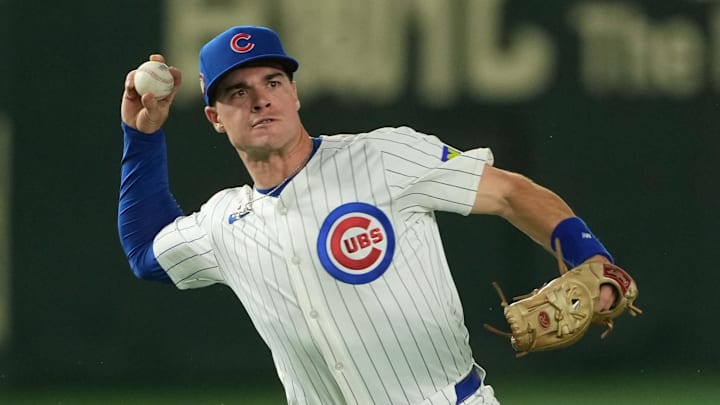 Mar 18, 2025; Bunkyo, Tokyo, JPN; Chicago Cubs second baseman Matt Shaw (6) throws the ball to first base in the third inning against the Los Angeles Dodgers during the Tokyo Series at Tokyo Dome.