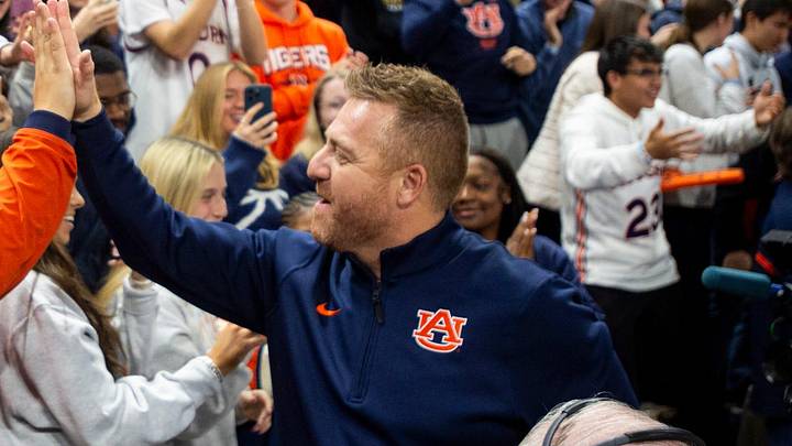 Newly hired Auburn football head coach Alex Golesh greets fans before Auburn Tigers take on NC State Wolfpack at Neville Arena in Auburn, Ala. on Wednesday, Dec. 3, 2025. Newly hired Auburn football head coach Alex Golesh greets fans before Auburn Tigers take on NC State Wolfpack at Neville Arena in Auburn, Ala. on Wednesday, Dec. 3, 2025.