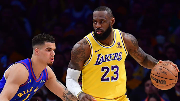Apr 25, 2024; Los Angeles, California, USA; Los Angeles Lakers forward LeBron James (23) controls the ball against Denver Nuggets forward Michael Porter Jr. (1) during the first half in game three of the first round for the 2024 NBA playoffs at Crypto.com Arena. 