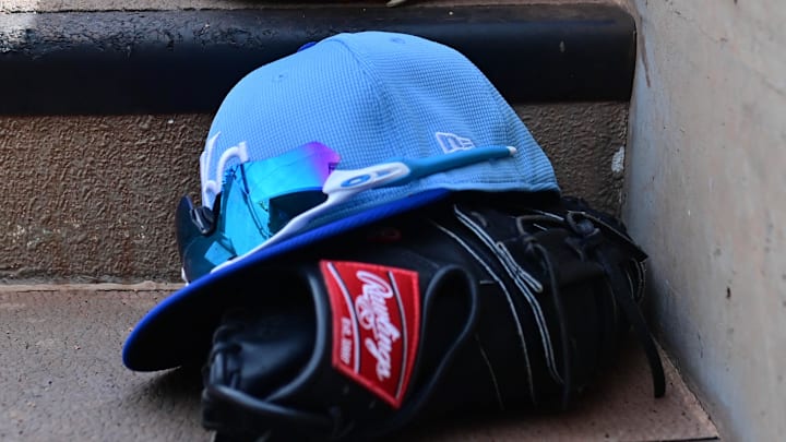 Mar 12, 2024; Salt River Pima-Maricopa, Arizona, USA;  General view of Kansas City Royals hats and gloves in the first inning against the Colorado Rockies during a spring training game at Salt River Fields at Talking Stick. 