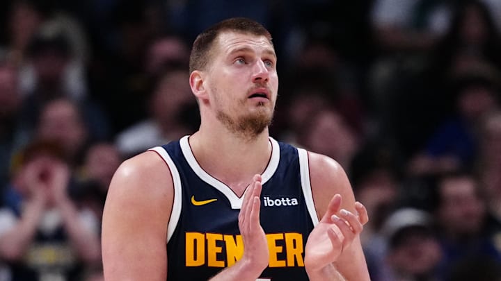 Mar 28, 2025; Denver, Colorado, USA; Denver Nuggets center Nikola Jokic (15) reacts in the third quarter against the Utah Jazz at Ball Arena. Mandatory Credit: Ron Chenoy-Imagn Images