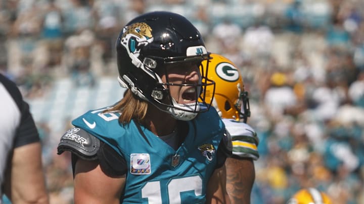 Oct 27, 2024; Jacksonville, Florida, USA; Jacksonville Jaguars quarterback Trevor Lawrence (16) celebrates a touchdown against the Green Bay Packers during the second quarter at EverBank Stadium. Mandatory Credit: Morgan Tencza-Imagn Images
