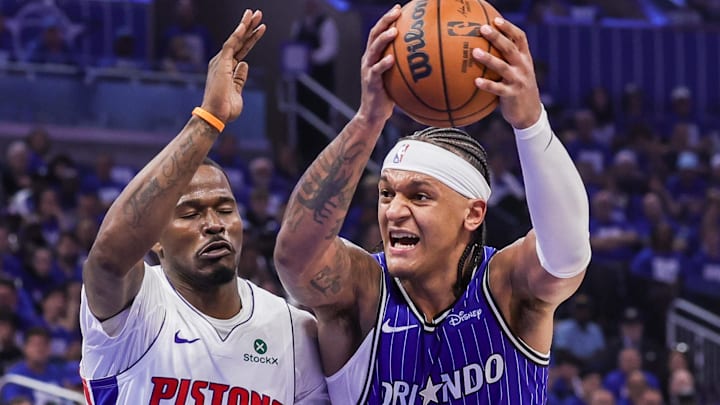 Apr 27, 2026; Orlando, Florida, USA; Orlando Magic forward Paolo Banchero (5) goes to the basket against Detroit Pistons guard Javonte Green (31) during the second half during game four of the first round of the 2026 NBA Playoffs at Kia Center. Mandatory Credit: Mike Watters-Imagn Images