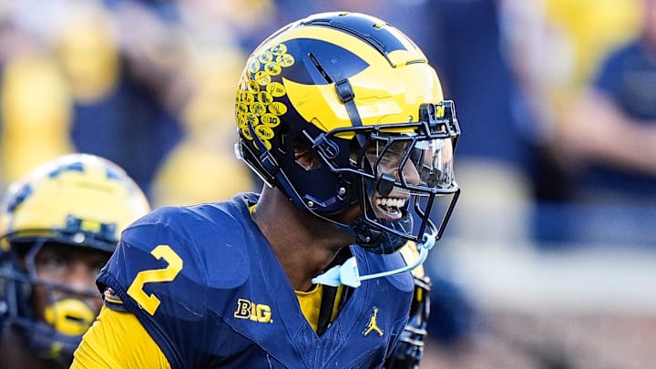 Michigan defensive back Will Johnson (2) celebrates a touchdown after intercepting USC quarterback Miller Moss (7) during the second half at Michigan Stadium in Ann Arbor on Saturday, Sept. 21, 2024.