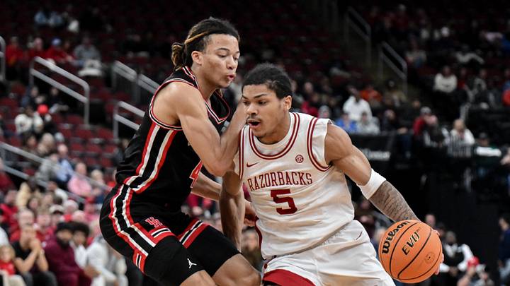 Dec 20, 2025; Newark, New Jersey, USA; Arkansas Razorbacks guard Darius Acuff Jr. (5) tries to drive past Houston Cougars guard Kingston Flemings (4) during the first half at Prudential Center. Dec 20, 2025; Newark, New Jersey, USA; Arkansas Razorbacks guard Darius Acuff Jr. (5) tries to drive past Houston Cougars guard Kingston Flemings (4) during the first half at Prudential Center.