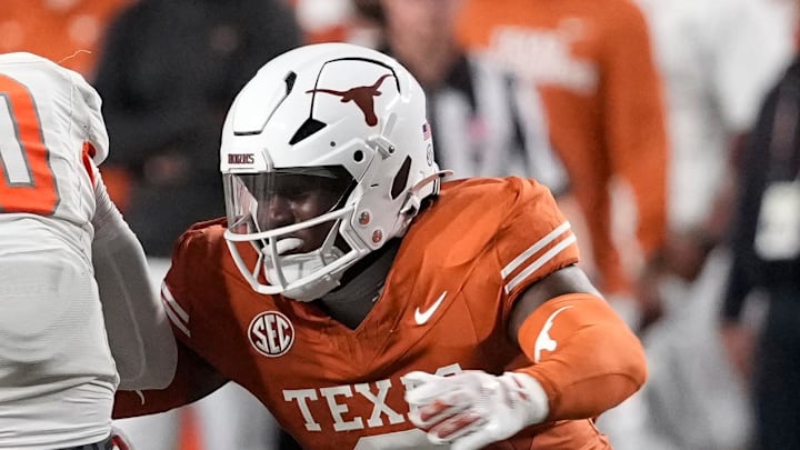 Sep 20, 2025; Austin, Texas, USA; Texas Longhorns linebacker Anthony Hill Jr (0) tackles Sam Houston Bearkats quarterback Grant Gunnell (10) during the second half at Darrell K Royal-Texas Memorial Stadium. Mandatory Credit: Scott Wachter-Imagn Images