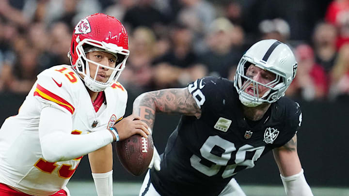 Oct 27, 2024; Paradise, Nevada, USA; Kansas City Chiefs quarterback Patrick Mahomes (15) is flushed out of the pocket by Las Vegas Raiders defensive end Maxx Crosby (98) during the second quarter at Allegiant Stadium. Mandatory Credit: Stephen R. Sylvanie-Imagn Images