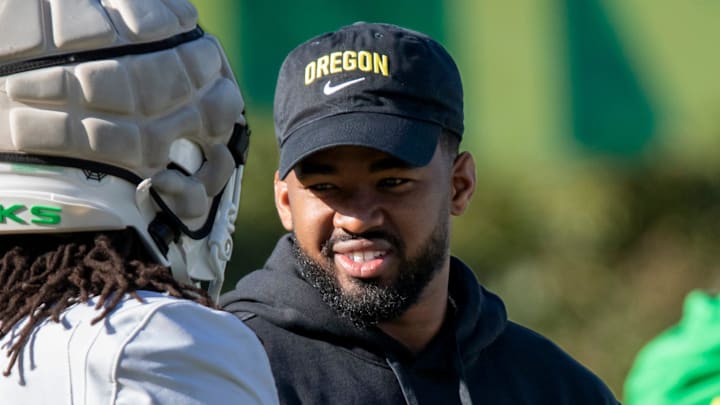New Oregon running backs coach Ra’Shaad Samples talks with running back Jordan James during practice with the Oregon Ducks Tuesday, April 9, 2024, at the Hatfield-Dowlin Complex in Eugene, Ore. New Oregon running backs coach Ra’Shaad Samples talks with running back Jordan James during practice with the Oregon Ducks Tuesday, April 9, 2024, at the Hatfield-Dowlin Complex in Eugene, Ore.