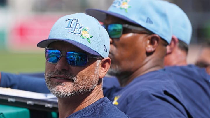 Feb 26, 2026; Fort Myers, Florida, USA; Tampa Bay Rays manager Kevin Cash looks on from the dugout during the fourth inning against the Boston Red Sox at JetBlue Park at Fenway South. 