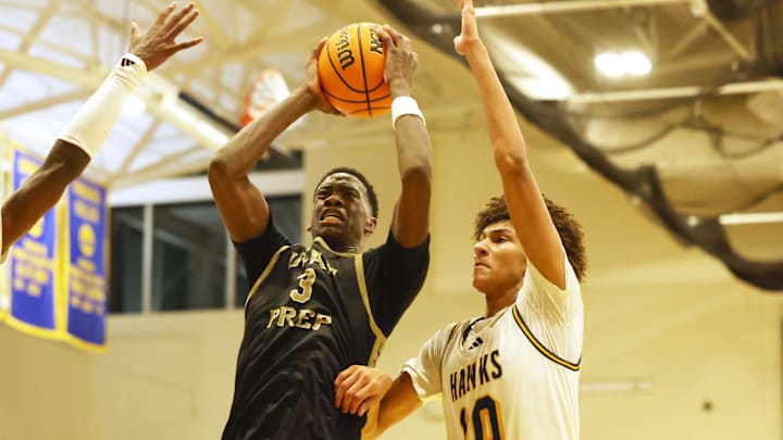 Utah Prep's AJ Dybantsa drives to the basket on Highland's Jemal Smith, left, and Nate Ament during a game at Emmanuel College in Boston on Tuesday, Nov. 5, 2024.