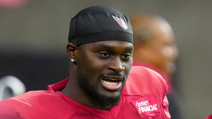 Cardinals running back Jeremiyah Love (4) talks with coaches during training camp at State Farm Stadium in Glendale on July 28, 2026. Cardinals running back Jeremiyah Love (4) talks with coaches during training camp at State Farm Stadium in Glendale on July 28, 2026.