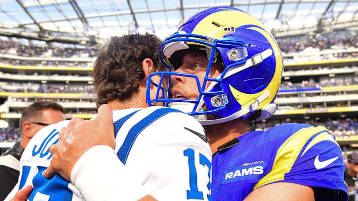 Sep 28, 2025; Inglewood, California, USA; Indianapolis Colts quarterback Daniel Jones (17) meets with Los Angeles Rams quarterback Matthew Stafford (9) following the game at SoFi Stadium. Mandatory Credit: Gary A. Vasquez-Imagn Images