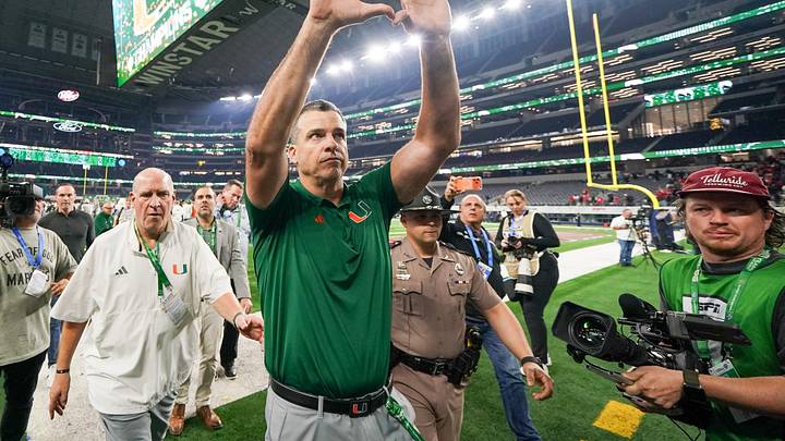 Dec 31, 2025; Arlington, TX, USA; Miami Hurricanes head coach Mario Cristobal leaves the field following the 2025 Cotton Bowl and quarterfinal game of the College Football Playoff against the Ohio State Buckeyes at AT&T Stadium. Mandatory Credit: Raymond Carlin III-Imagn Images