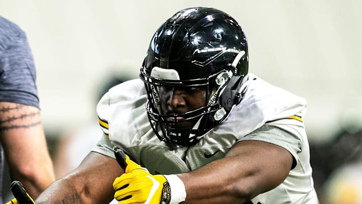 Defensive lineman Anterio Thompson runs through a drill while with Iowa in 2023.