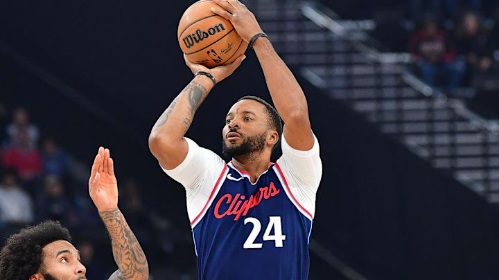 Nov 4, 2024; Inglewood, California, USA; Los Angeles Clippers guard Norman Powell (24) shoots against San Antonio Spurs forward Julian Champagnie (30) during the first half at Intuit Dome. Mandatory Credit: Gary A. Vasquez-Imagn Images
