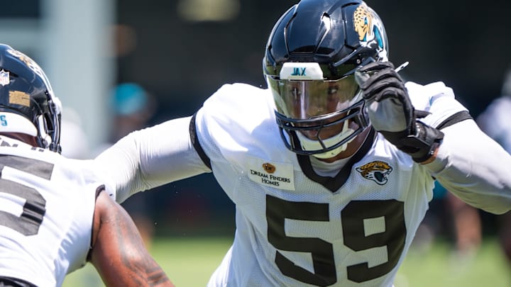 Jacksonville Jaguars defensive end BJ Green II (95) and Jacksonville Jaguars defensive end Myles Cole (59) run drills during the fourth organized team activity at the Miller Electric Center in Jacksonville, Fla. Tuesday, May 27, 2025. [Doug Engle/Florida Times-Union]