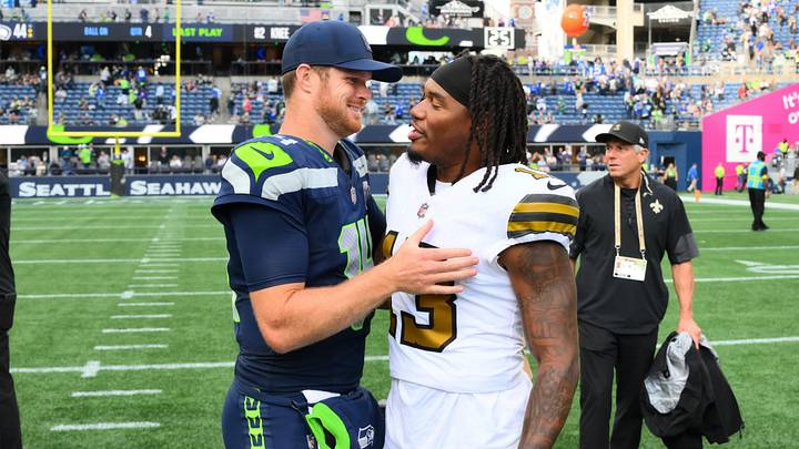 Sep 21, 2025; Seattle, Washington, USA; Seattle Seahawks quarterback Sam Darnold (14) and New Orleans Saints running back Velus Jones Jr. (13) shake hands after the game at Lumen Field. Mandatory Credit: Steven Bisig-Imagn Images Sep 21, 2025; Seattle, Washington, USA; Seattle Seahawks quarterback Sam Darnold (14) and New Orleans Saints running back Velus Jones Jr. (13) shake hands after the game at Lumen Field. Mandatory Credit: Steven Bisig-Imagn Images