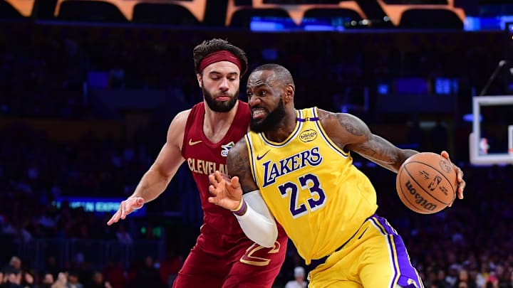 Dec 31, 2024; Los Angeles, California, USA; Los Angeles Lakers forward LeBron James (23) moves to the basket against Cleveland Cavaliers guard Max Strus (1) during the first half at Crypto.com Arena. Mandatory Credit: Gary A. Vasquez-Imagn Images